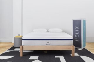 Helix Midnight mattress on wooden bedframe