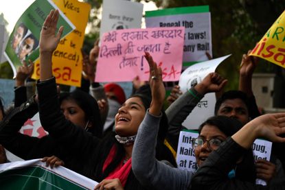 Demonstrators take part in a march organised in support of farmers protesting against the central governments recent agricultural reforms in New Delhi on February 3, 2021.