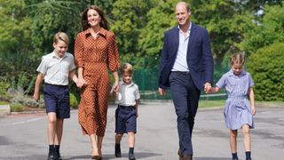 Prince George, Princess Charlotte and Prince Louis (C), accompanied by their parents the Prince and Princess of Wales, arrive for a settling in afternoon at Lambrook School, near Ascot on September 7, 2022 in Bracknell, England.