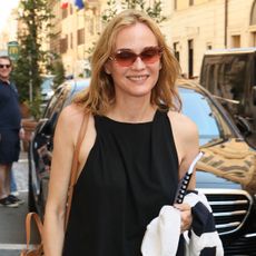 Diane Kruger wearing a black top and pants in Rome
