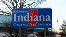 A 'Welcome to Indiana' sign is seen on a billboard in Clarksville, Indiana.