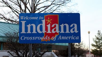 A 'Welcome to Indiana' sign is seen on a billboard in Clarksville, Indiana.
