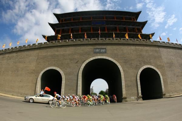 The riders pass the city gate of Wuwei