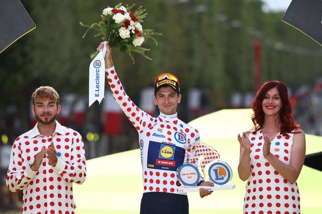 Lidl Treks Italian rider Giulio Ciccone celebrates on the podium with the best climbers polka dot dotted jersey after the 21st and final stage of the 110th edition of the Tour de France cycling race 115 km between SaintQuentinenYvelines and the ChampsElysees in Paris on July 23 2023 Photo by AnneChristine POUJOULAT AFP Photo by ANNECHRISTINE POUJOULATAFP via Getty Images