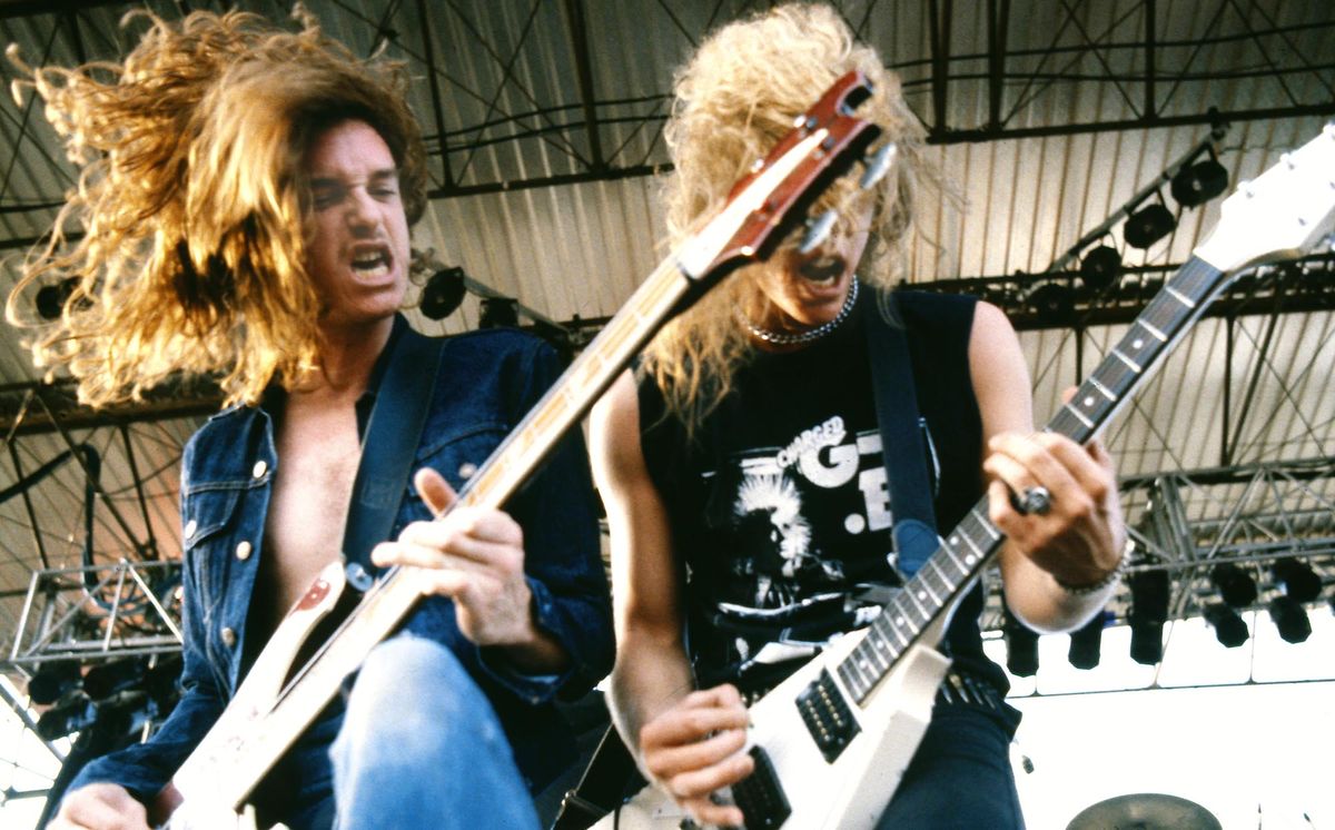 Cliff Burton (left) and James Hetfield perform onstage with Metallica