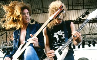 Cliff Burton (left) and James Hetfield perform onstage with Metallica – Hetfield is playing his legendary white V