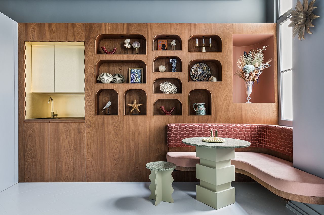 modern banquette with modern green dining table and built in shelving