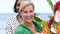 Sophie, Duchess of Edinburgh smiles with a large bouquet of flowers on day six of the Platinum Jubilee Royal Tour of the Caribbean on April 27, 2022 in Soufriere, Saint Lucia
