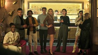 (L to R) Ozioma Whenu as Blessing, Ben Wiggins as Roald, Dario Coates as Connie, Lukas Gage as Adam, Tilly Keeper as Lady Phoebe, Charlotte Ritchie as Kate and Niccy Lin as Sophie Soo in episode 403 of You.