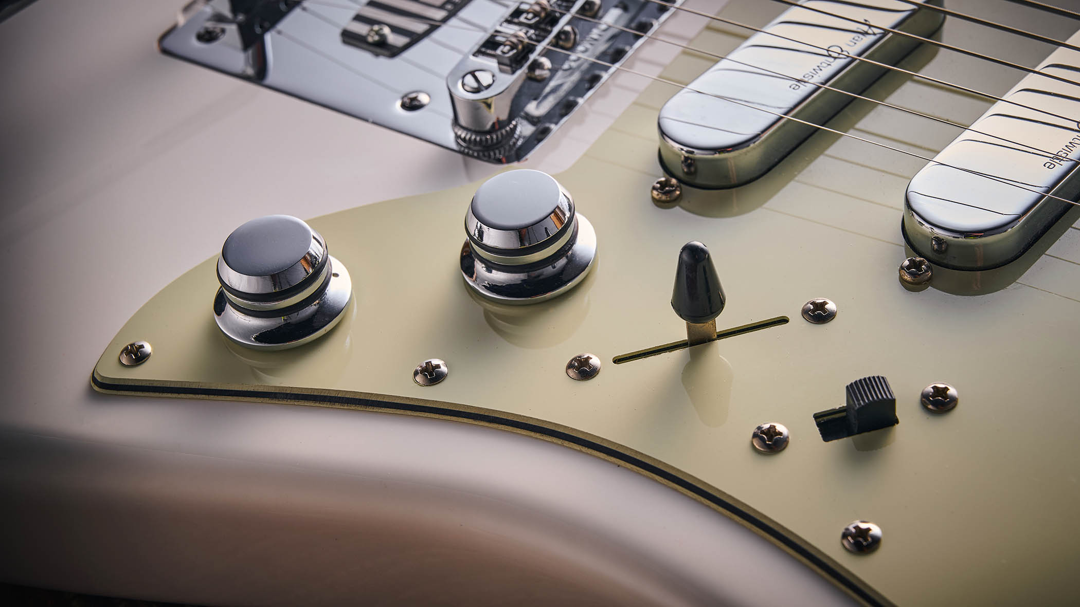 Vintage REVO Astrostar: the retro-inspired electric has three single-coils, a white finish with cream pickguard and is photographed in close-up.