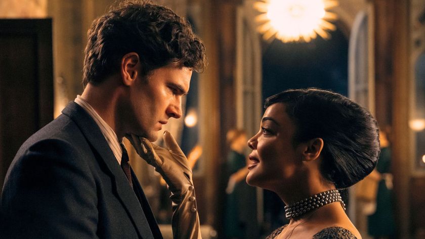Tessa Thompson holds Tom Bateman&#039;s chin in a gloved hand