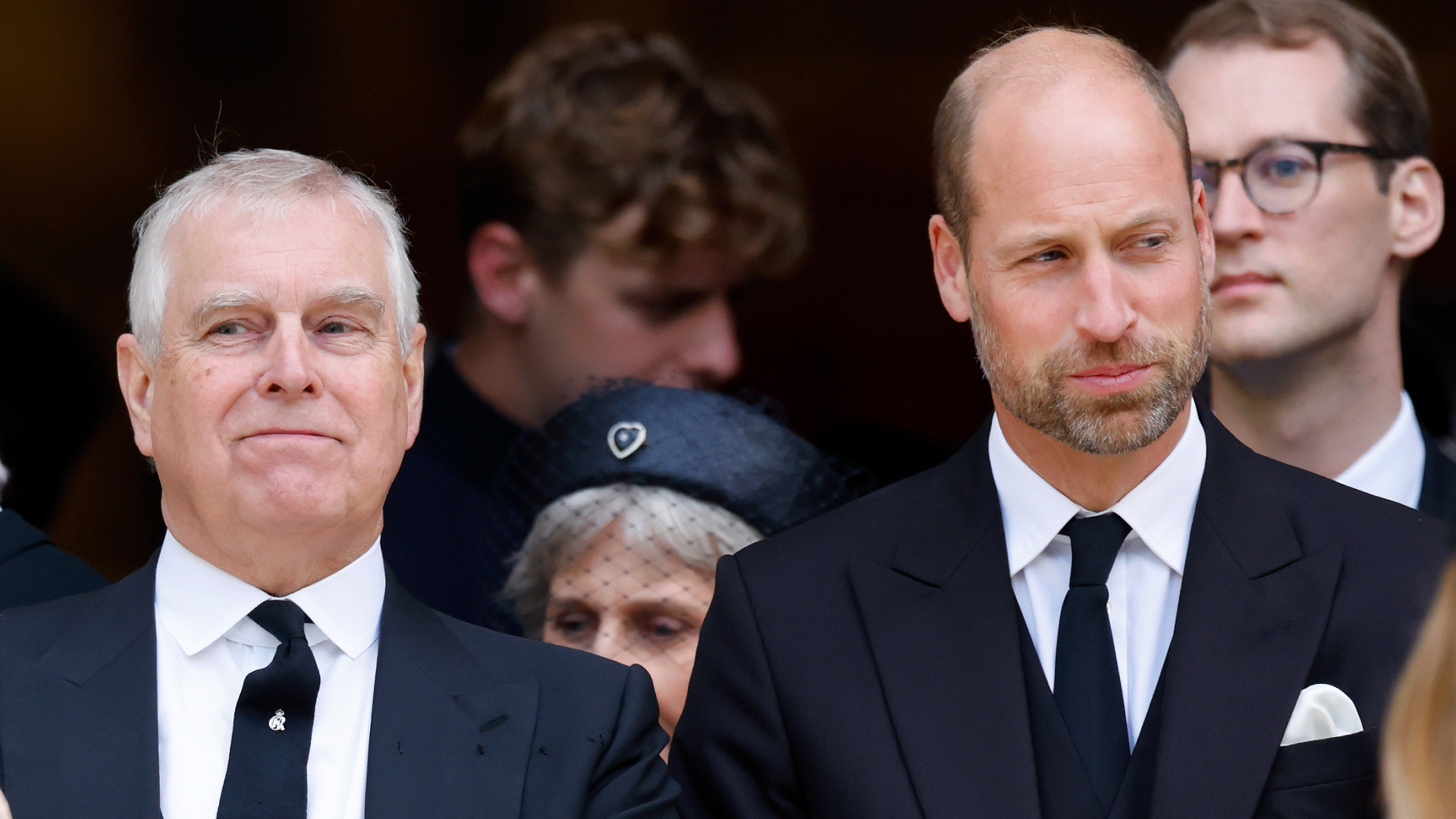 Prince Andrew and Prince William both wear black suits to attend a funeral