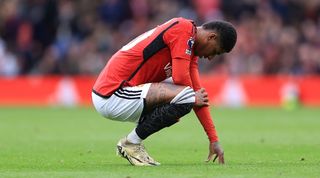 Marcus Rashford looks dejected during a Manchester United game against Liverpool in April 2024.