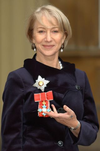 Helen Mirren after being invested as a Dame from the Prince of Wales during a ceremony held at Buckingham Palace in 2003