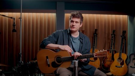 A still of John Mayer in the studio with a Martin 000 acoustic guitar