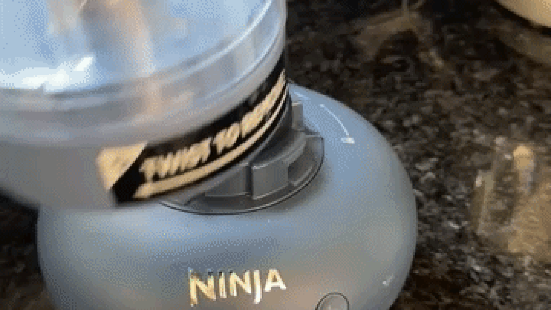 Our tester demonstrates how easily the Ninja BlendBoss cup attaches to its base for blending.