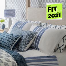 Picture of a bed with pillows and a get fit for 2021 badge