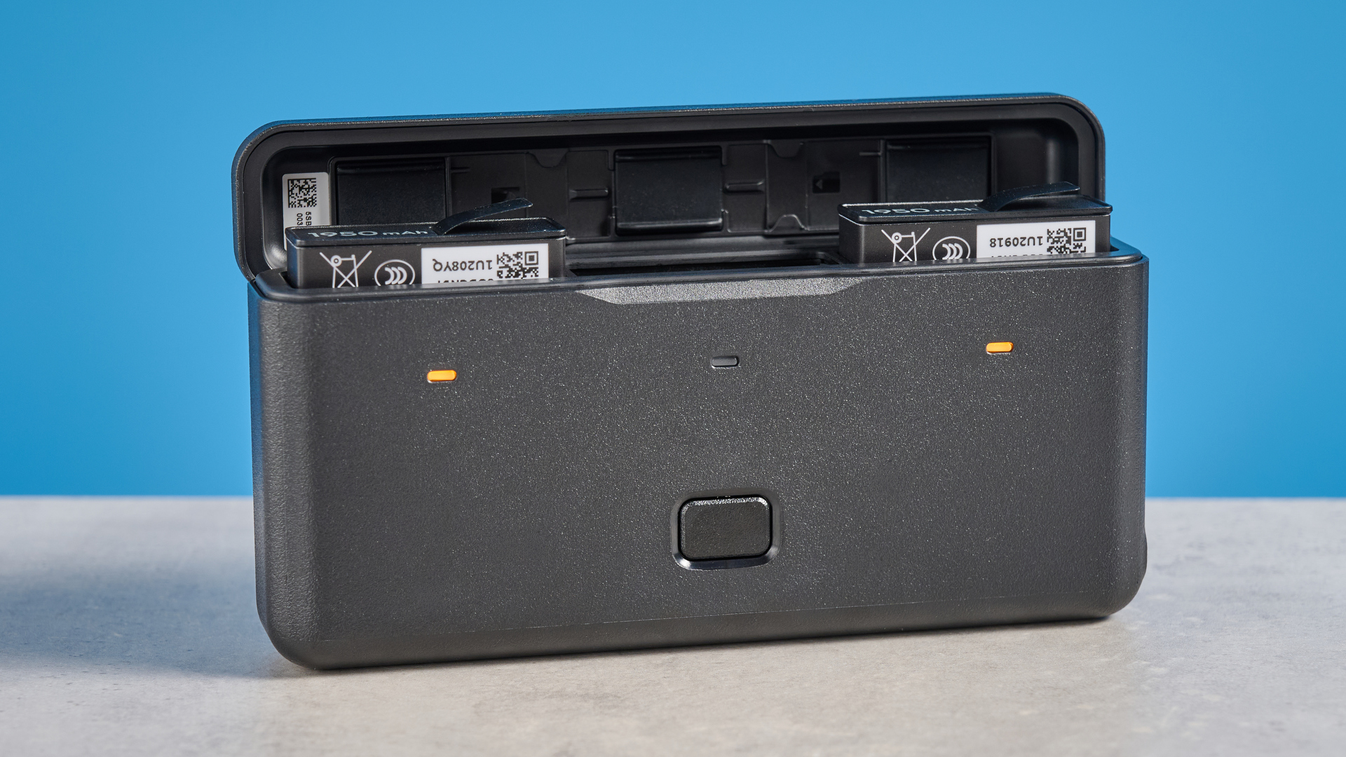 The DJI Osmo 360 optional battery pack against a blue background