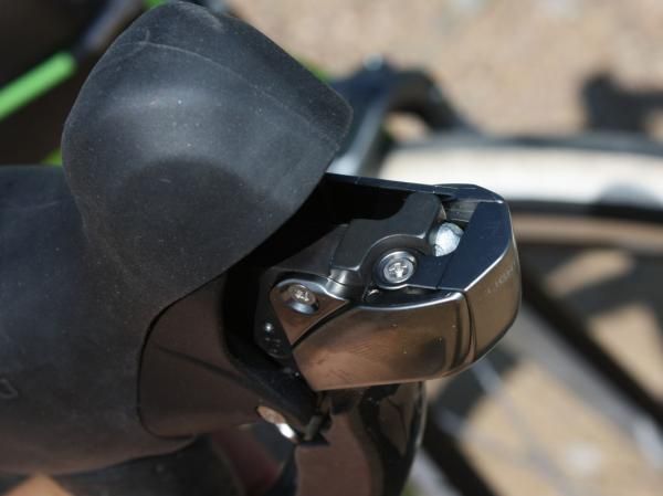 Brake cables are accessible only behind a cosmetic cover plate, which is annoyingly held in place with a tiny Phillips-head screw.