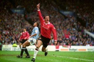 Eric Cantona celebrates scoring for Manchester United