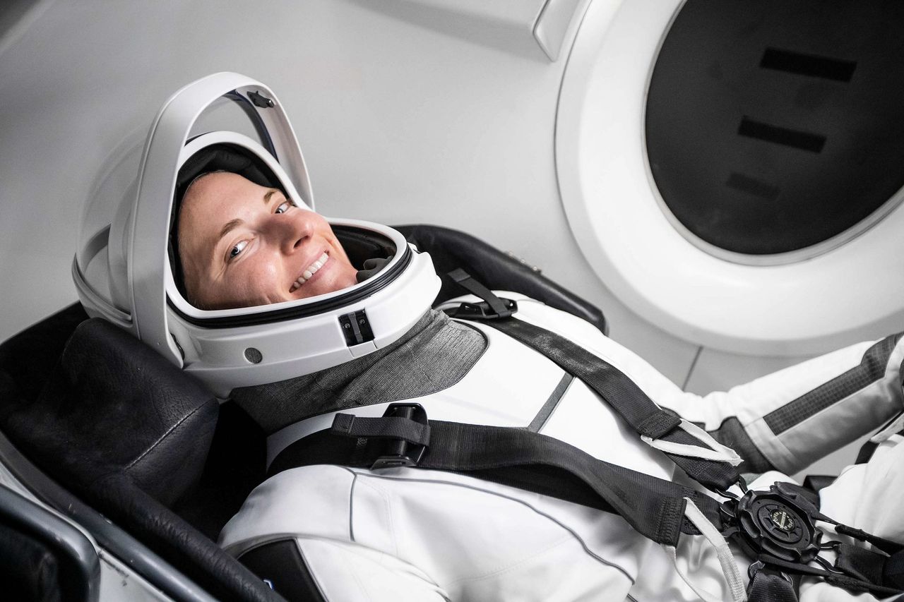 NASA astronaut Kayla Barron, Crew-3 mission specialist, poses for a photo inside SpaceX's Crew Dragon capsule.