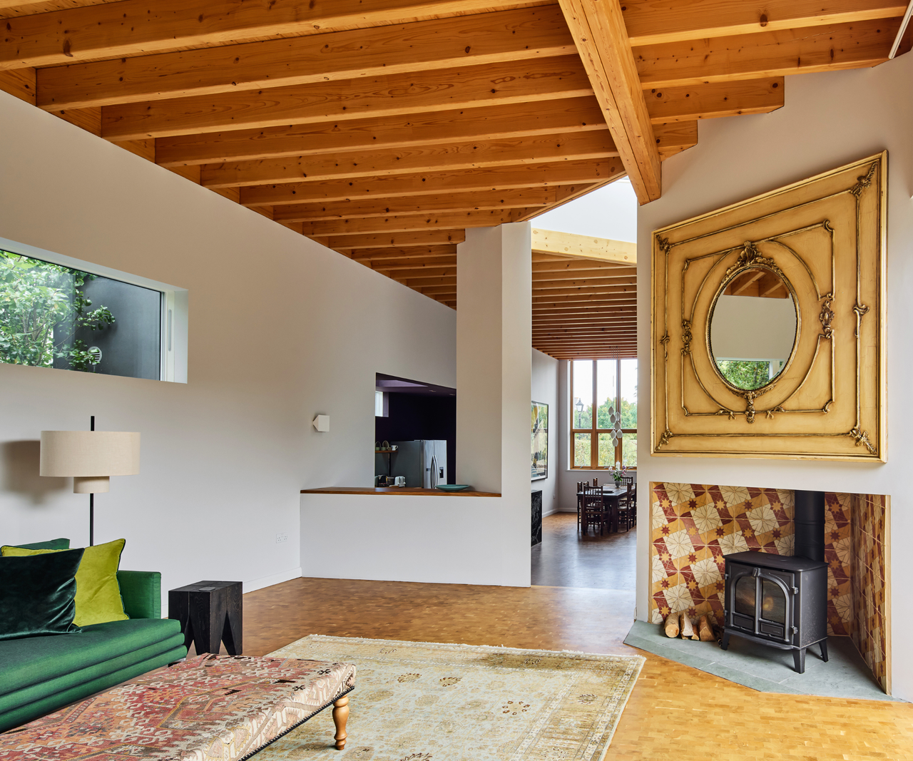 Living room leading onto kitchen area in background to the left