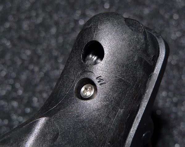 A small bolt underneath the hood