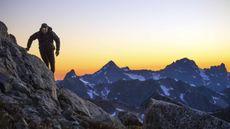 A mountain climber nears the top