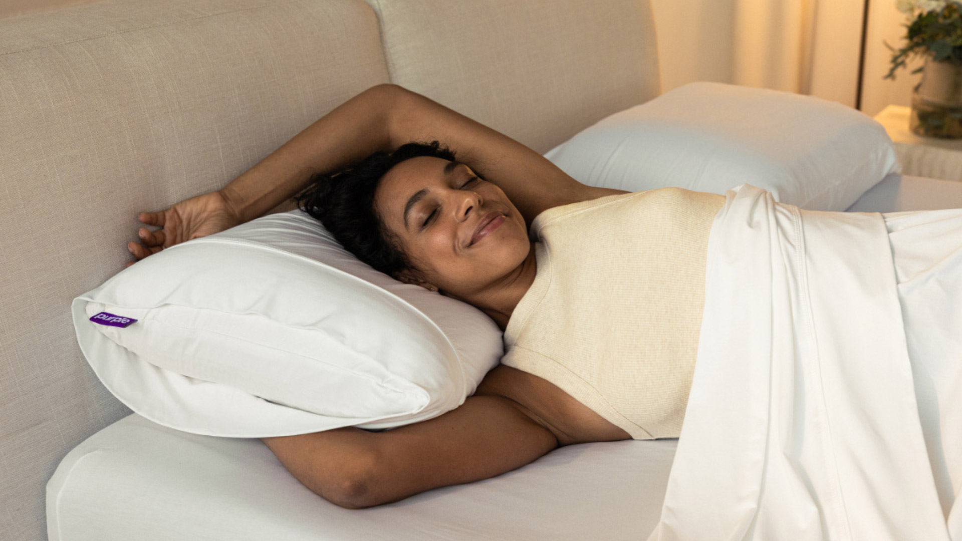 Woman sleeping on the Purple Harmony Pillow