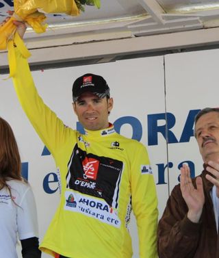 Alejandro Valverde (Caisse d'Epargne) celebrates on the podium.
