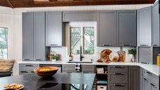 Kortney Wilson's modern kitchen with blue cabinets and quartz countertops