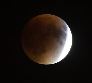 NASA photographer Aubrey Gemignani captured this amazing view of the perigee moon total lunar eclipse over Washington, D.C. on Sept. 27, 2015.
