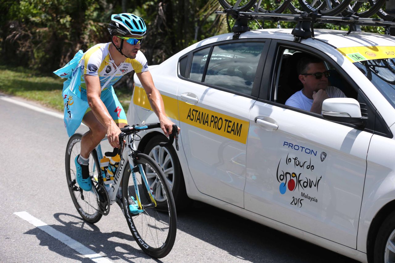 Andrea Guardini (Astana) drops back to the team car on domestique duty