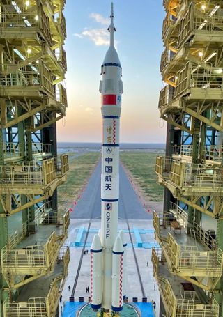 The Long March 2F to launch Shenzhou 13 crew spacecraft being vertically transferred to the pad at Jiuquan, Oc. 7, 2021.