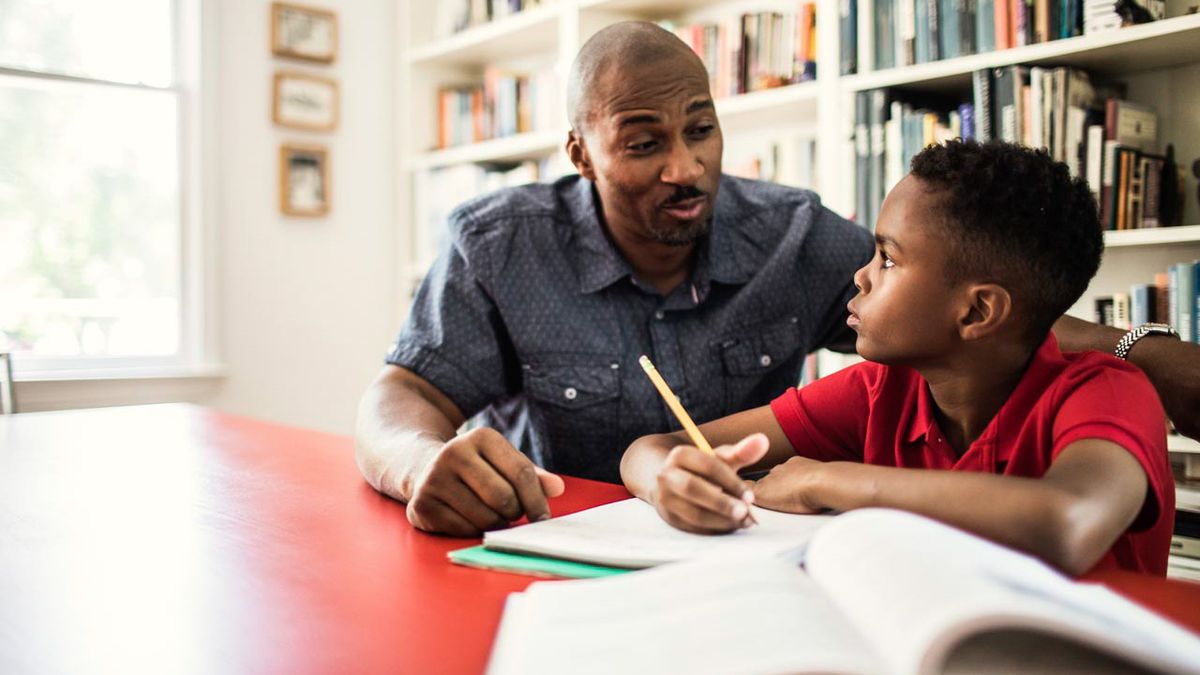 Dad doing homework with his son