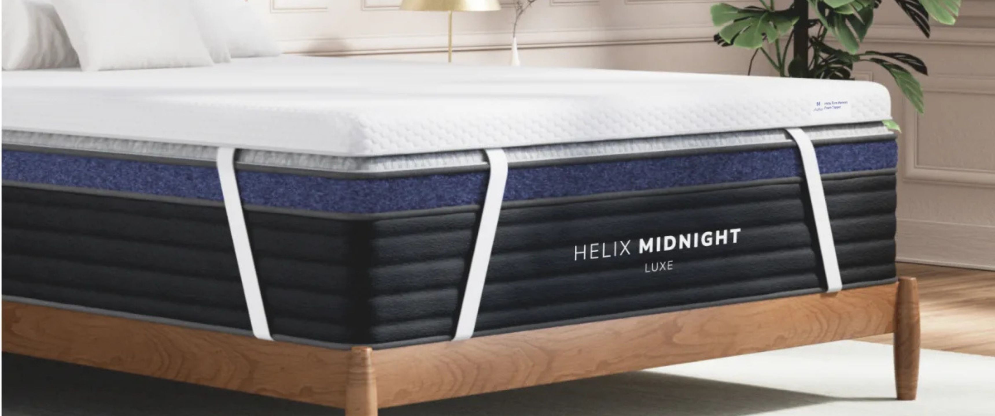 The Helix Premium Memory Foam Mattress Topper with GlacioTex on top of the Helix Midnight Luxe Mattress in a clean, well-lit bedroom. 