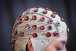 The system uses EEG brain signals to detect if a person notices robots making a mistake.