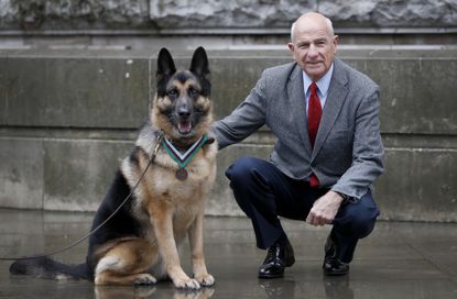 John Wren with military dog Ayron.