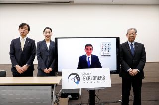 Japan Aerospace Exploration Agency (JAXA) executive director Hiroshi Sasaki (at left) and president Hiroshi Yamakawa (at right) with new astronaut candidates Ayu Yoneda and Makoto Suwa (on the screen) in Tokyo on Tuesday, Feb. 28, 2023.