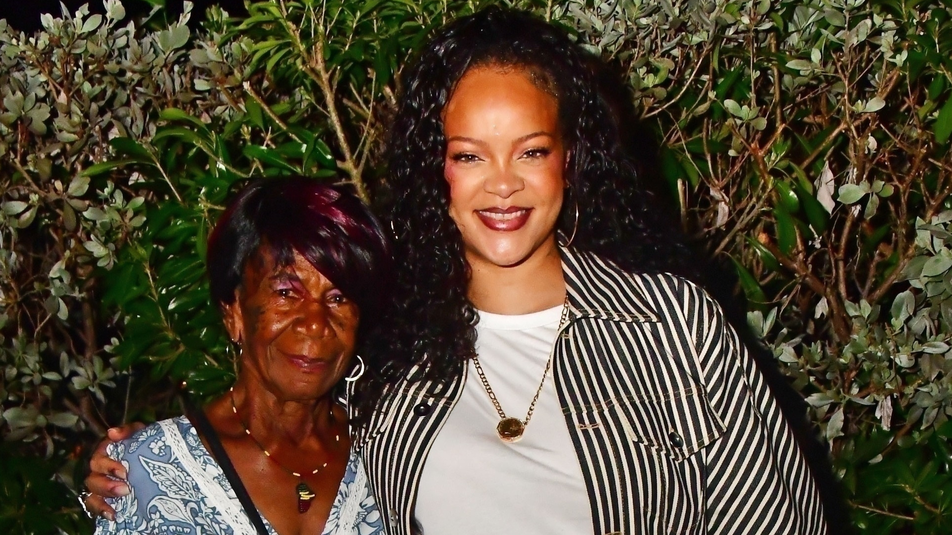 Rihanna was spotted in Barbados wearing Miu Miu snakeskin sneakers and a rare Longchamp Le Pilage bag