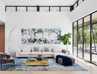 A white walled living room with wall art