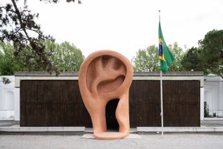 Art by Jonathas de Andrade of a big ear 'with the heart coming out of the mouth', at the Pavilion of Brazil
