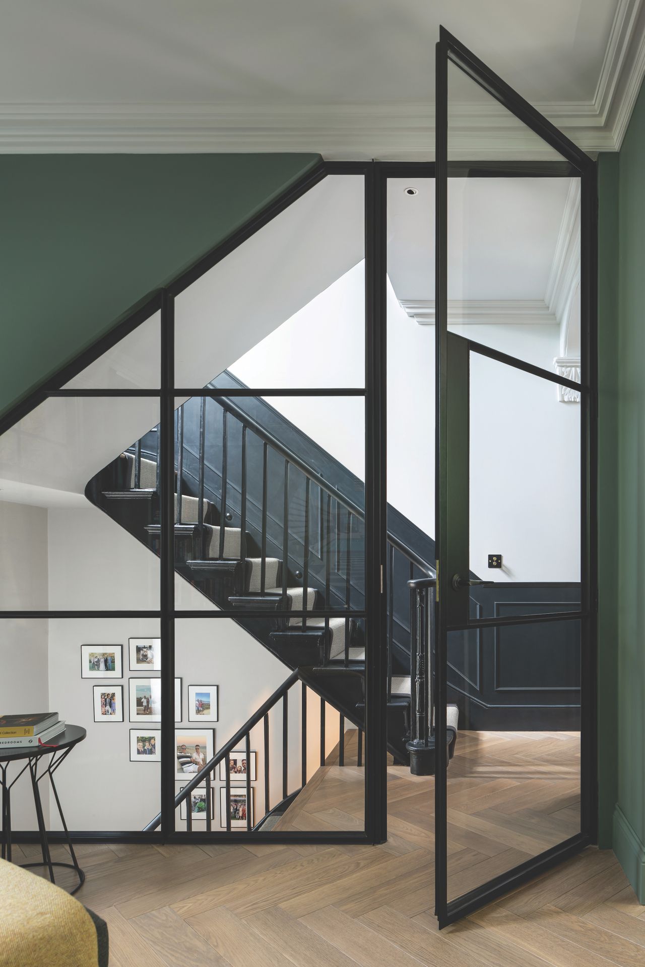 view of modern staircase in remodelled house with steel glass internal windows