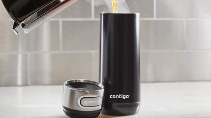 One of the best travel mugs, the Contigo Luxe, being filled with coffee