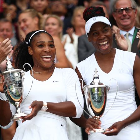 Serena and Venus Williams wear matching white tennis outfits at Wimbledon in 2016