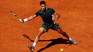 Carlos Alcaraz of Spain plays a forehand in the Men's Singles semi-finals match at the Madrid Open
