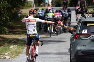 Toms Skujins (Trek Segafredo) gets bottles from the team car at the Maryland Cycling Classic