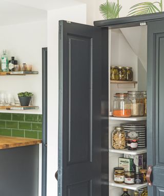 Grey pantry with white shelves