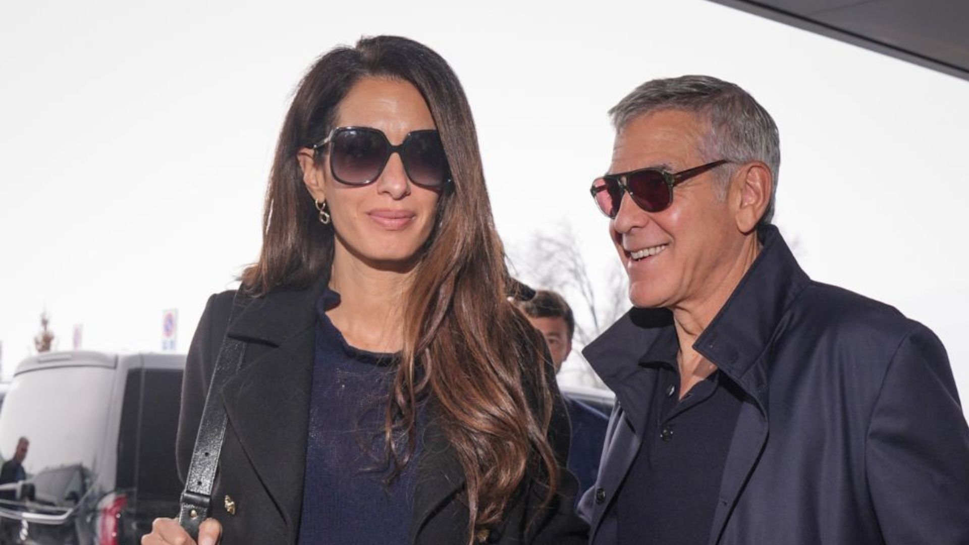 George Clooney and Amal Clooney are seen arriving at the airport on February 08, 2026 in Milan, Italy. (