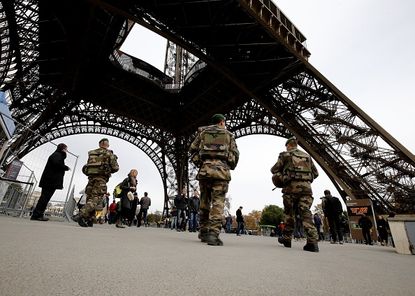 French soldiers patrol the Eiffel Tower after series of terrorist attacks